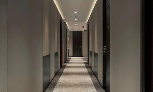 a hallway of a building with a long corridor at Minasi Grand Hotel in Hanoi