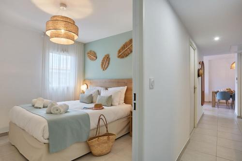 a bedroom with a bed with towels on it at Résidence Odalys Riviera in Hyères