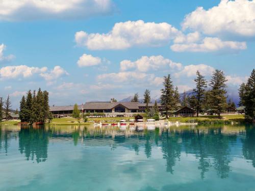 a large body of water in front of a building at Fairmont Jasper Park Lodge in Jasper