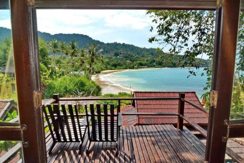 a balcony with a view of a beach at Kantiang Seahorse Resort & Spa in Ko Por
