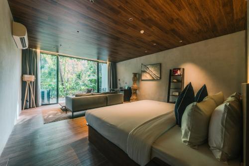 Letto o letti in una camera di Piece Lio from Japan Managed by H Hospitality Group