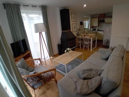 a living room with a couch and a table at Domek Łagów Lubuski in Łagów
