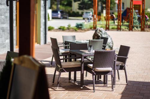 a table and chairs sitting on a patio at Hotel DARO in Banská Štiavnica
