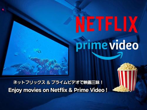 a sign for a movie theater with a popcorn at "100インチスクリーン&プロジェクターで映画三昧!, 人気のリゾートタウン北谷で暮らすように過ごす, ゆったり64平米2LDK" Villa Blu Okinawa Chatan 2-3 ヴィラブルー沖縄北谷2-3 in Chatan