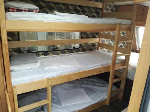a couple of bunk beds in a room at Zielony Port numer 2 in Władysławowo