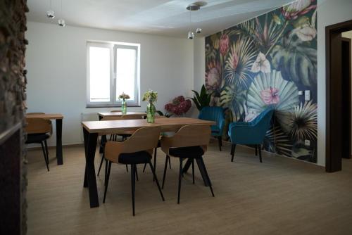 a dining room with a table and some chairs at Penzion 666 Slavonice in Slavonice