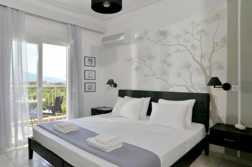 Cama ou camas em um quarto em Hotel Kalloni
