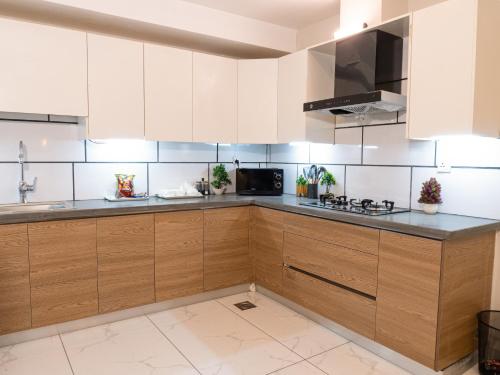 Η κουζίνα ή μικρή κουζίνα στο Fior Residence 1BHK Apt