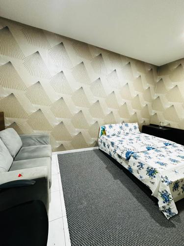 Katil atau katil-katil dalam bilik di Elite Shine Holiday Home