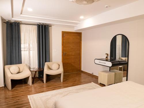 Ένα ή περισσότερα κρεβάτια σε δωμάτιο στο Fior Residence 1BHK Apt
