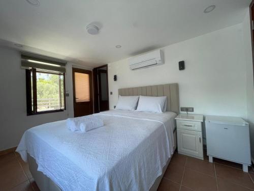 Postel nebo postele na pokoji v ubytování Kaşhan Otel