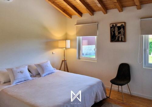 En eller flere senge i et værelse på MyStay - Quinta do Louro