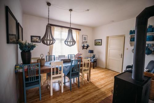 a kitchen and dining room with a table and chairs at Holiday Home Elizabeth in Svojek
