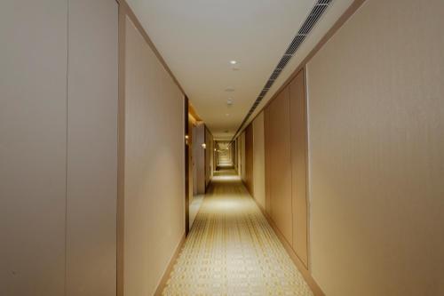 a corridor in a building with a long hallway at The Tivoli New Delhi in New Delhi