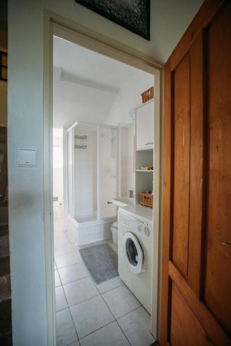 a laundry room with a washer and dryer at Holiday Home Elizabeth in Svojek