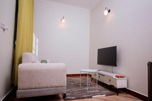 Et tv og/eller underholdning på Reza Stays Apartment near mwananyamala hospital & CBD