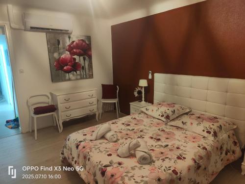 a bedroom with a bed and a dresser at Chambres d'hôtes Gaffes in Saubrigues