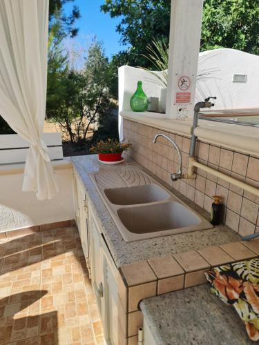Φωτογραφία από το άλμπουμ του Casa vacanze "Il Carrubo" σε Gagliano del Capo