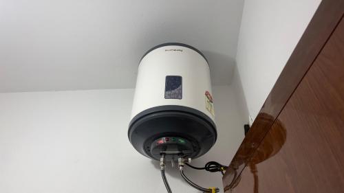a security light on the ceiling of a room at SHI's Agam Bed & Breakfast at Chennai in Chennai