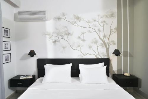 Cama ou camas em um quarto em Hotel Kalloni