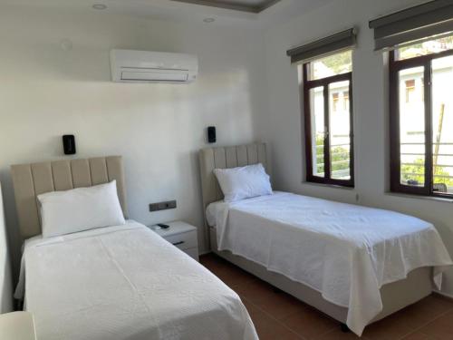 Postel nebo postele na pokoji v ubytování Kaşhan Otel