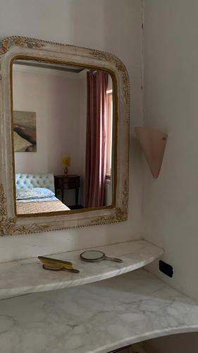 a mirror sitting on top of a counter in a room at B&B Villa Pina in Colleferro