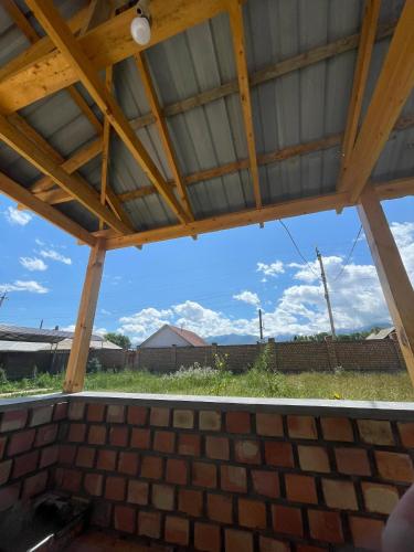 a view from the inside of a patio roof at Mountain View in Kochkor