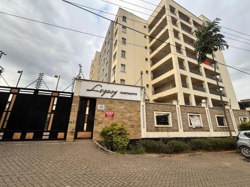 a building with a sign that reads happy memory at Lina Apartment in Nairobi