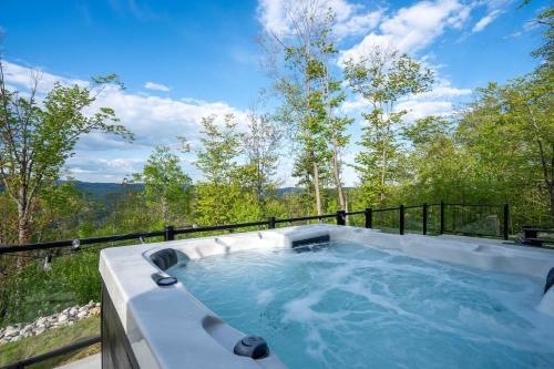 a hot tub on top of a balcony with trees at View Montain & Spa - Casablanca in Saint Come