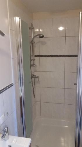 a bathroom with a shower and a sink at Hotel Deutsches Haus Francop in Hamburg