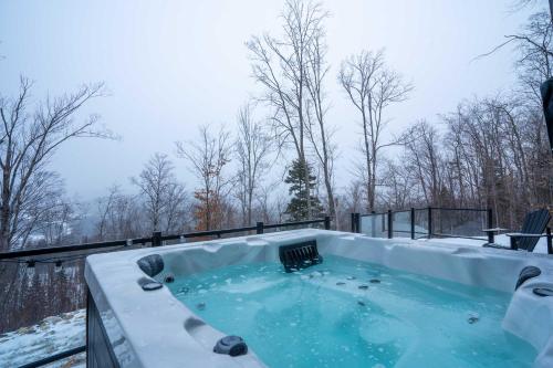 a hot tub covered in snow on a patio at View Montain & Spa - Casablanca in Saint Come