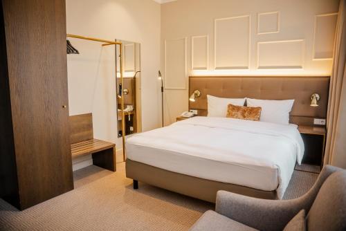 Parkhotel Kurhausにあるベッド