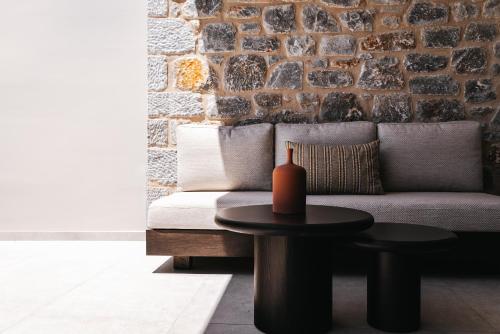 a living room with a couch and a table at Castor & Pollux in Kotrónion