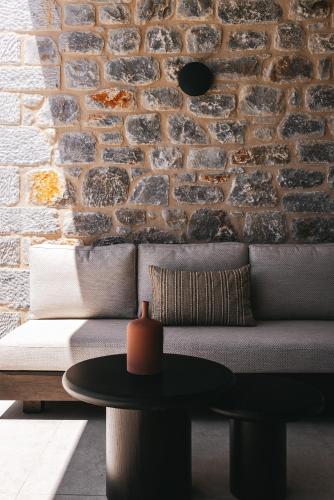 a living room with a couch and a table at Castor & Pollux in Kotrónion