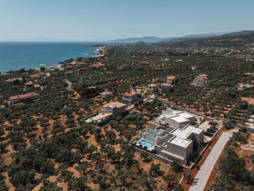 an aerial view of a city and the ocean at Castor & Pollux in Kotrónion