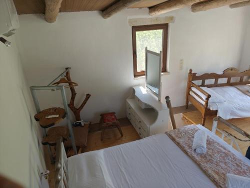 Ένα ή περισσότερα κρεβάτια σε δωμάτιο στο Kourtsa villas