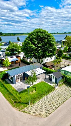 an overhead view of a small town with a lake at Chalet VeerLake in Lathum