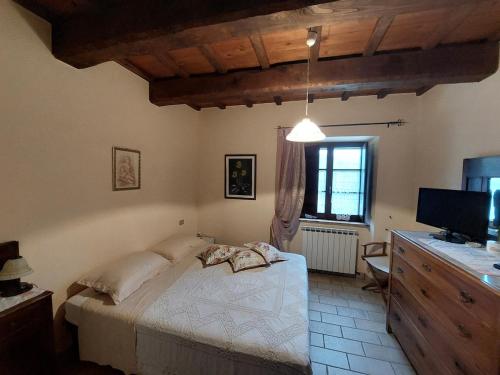 Ένα ή περισσότερα κρεβάτια σε δωμάτιο στο Casa dei Tulipani