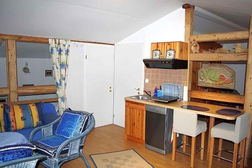 a kitchen with a table and chairs in a room at Apartment in Putbus II in Putbus