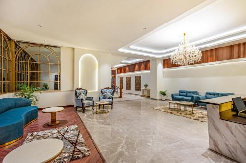 Ruang duduk di Sterling GK Exotica Dehradun