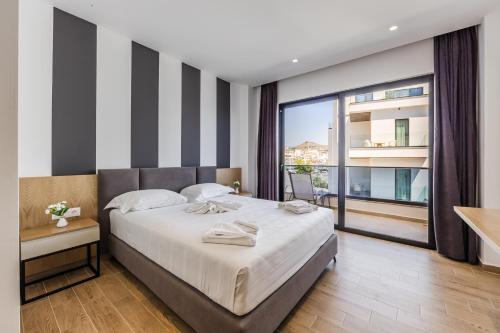 Cama o camas de una habitación en Hotel Kompleks Joni