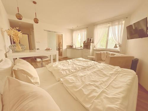 Posteľ alebo postele v izbe v ubytovaní Trio Apartments