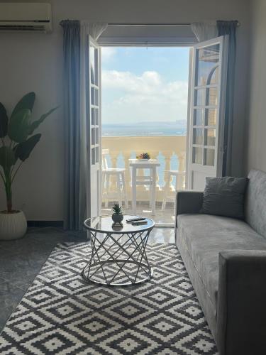 a living room with a couch and a table at Qaitbay Citadel View in Alexandria