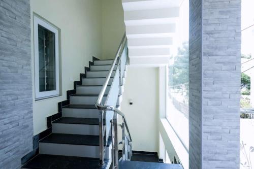 a staircase in a house with a window at Cozy Heaven in Ooty