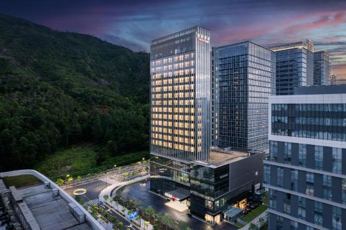 an aerial view of a tall building in a city at IntercityHotel Zhuhai Xiangzhounanping with Free Mini Bar in Zhuhai