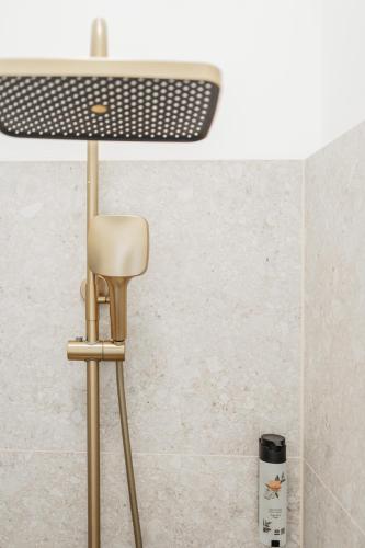 a stool in a bathroom with a ceiling at HOME1 - District Twelve Boutique Hostel in Vienna