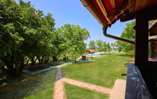 a view of a park with trees and benches at Villa 77 by Villas Guide in Sisak
