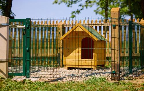 a cage with a play house inside of it at Villa 77 by Villas Guide in Sisak