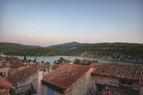 a view of a river from the roofs of buildings at Lake View and Sheltered Terrace in Bauduen