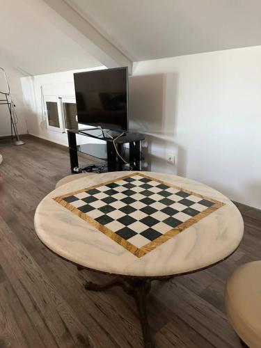 a living room with a chess board on a table at Kerch Apartments in Radovići